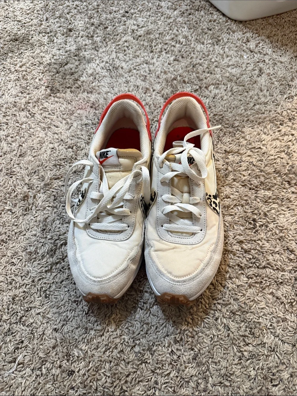 Nike White Sneakers with Red Interior and Black Swoosh